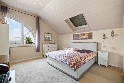 room / bedroom with vaulted ceiling, light wood-style floors, wood ceiling, and a skylight