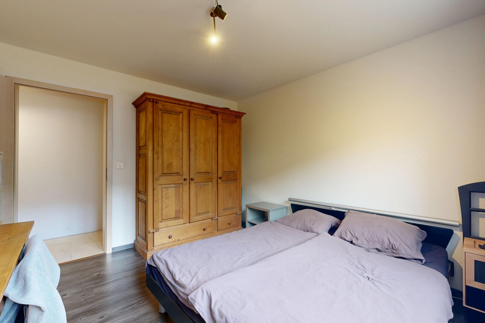 room / bedroom with dark wood finished floors