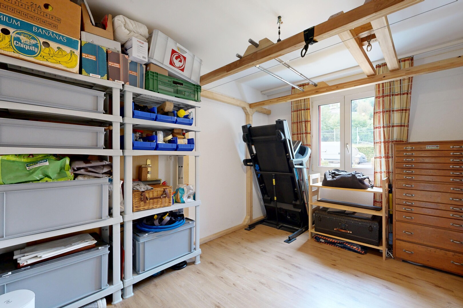 office area with light wood-style floors and baseboards