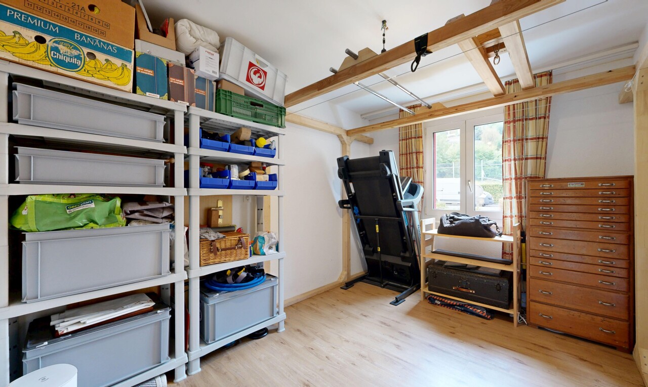 office area with light wood-style floors and baseboards