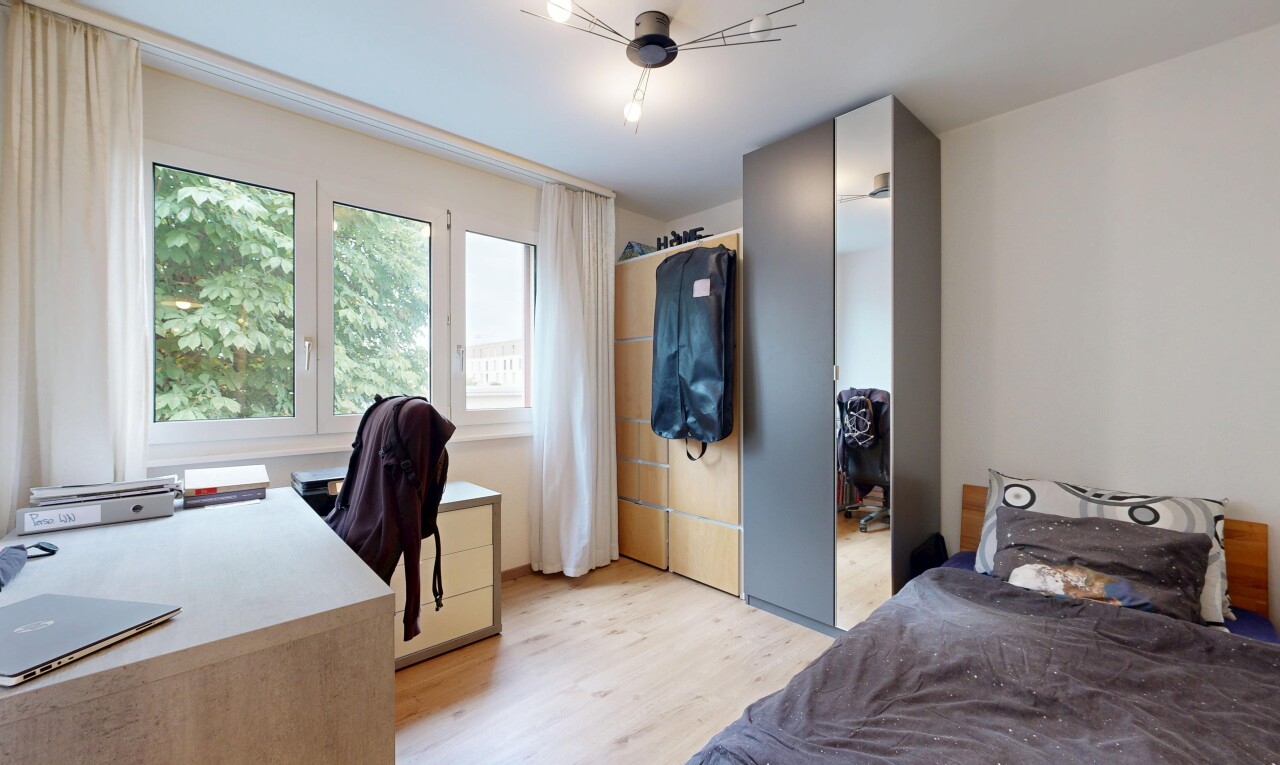room / bedroom with a desk and light wood-type flooring