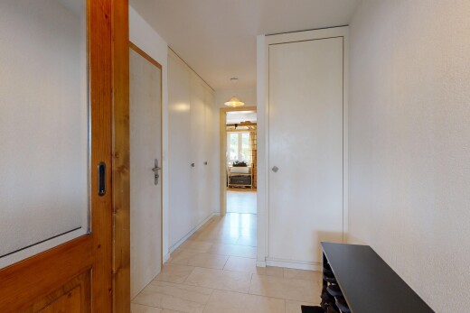 corridor with light tile patterned floors
