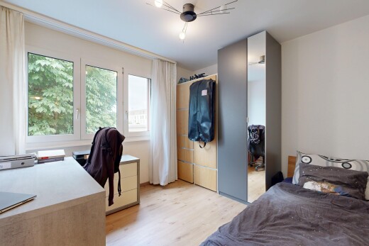 room / bedroom with a desk and light wood-type flooring