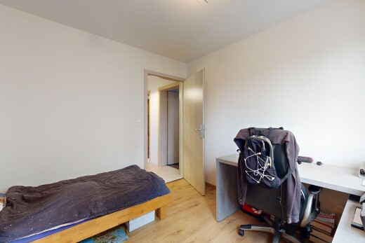 room / bedroom featuring an office area and light wood-style flooring