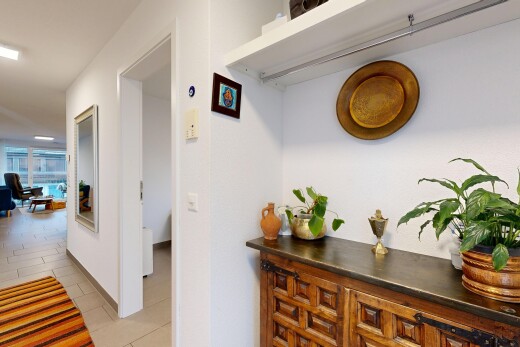 corridor featuring light tile patterned floors