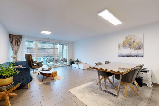living / dining area with light tile patterned floors