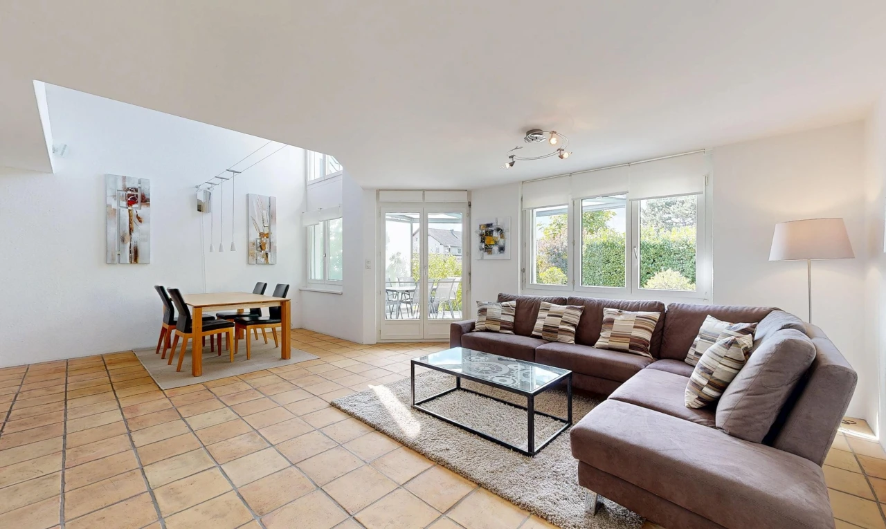 living / dining room with rail lighting, access to exterior, and light tile patterned floors
