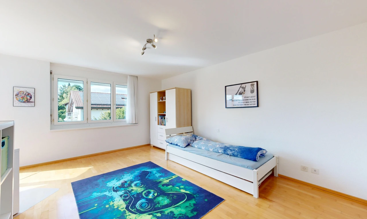 room / bedroom featuring light wood-style flooring and baseboards