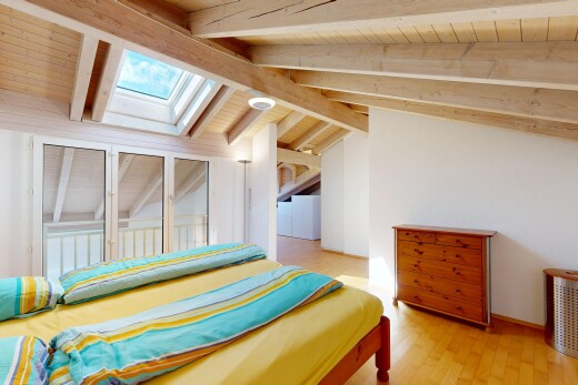 room / bedroom with light wood finished floors, lofted ceiling with skylight, and wooden ceiling