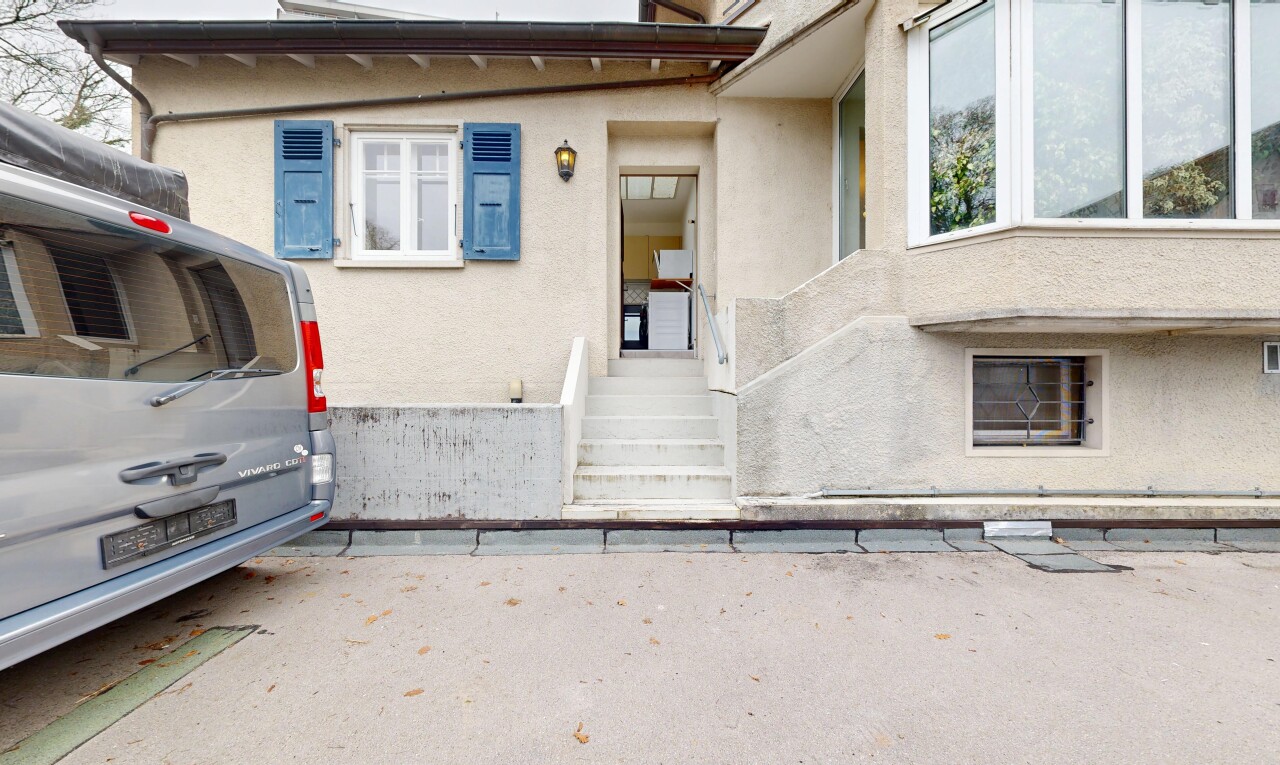 façade avec bardage en stuc, property visible, perron, et overcast