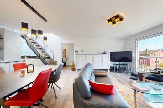living / dining area with wood finished floors and stairs