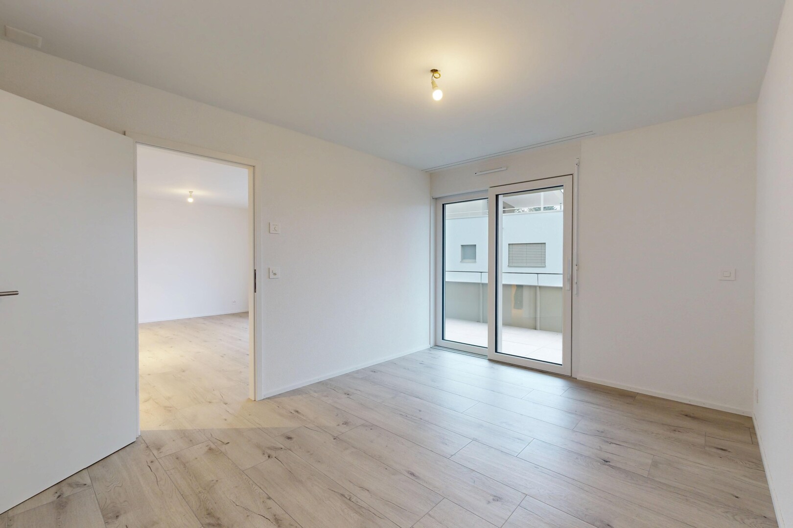 pièce vide avec cloison sèche, drywall, sol en finition bois, wood finish floor, et inside property