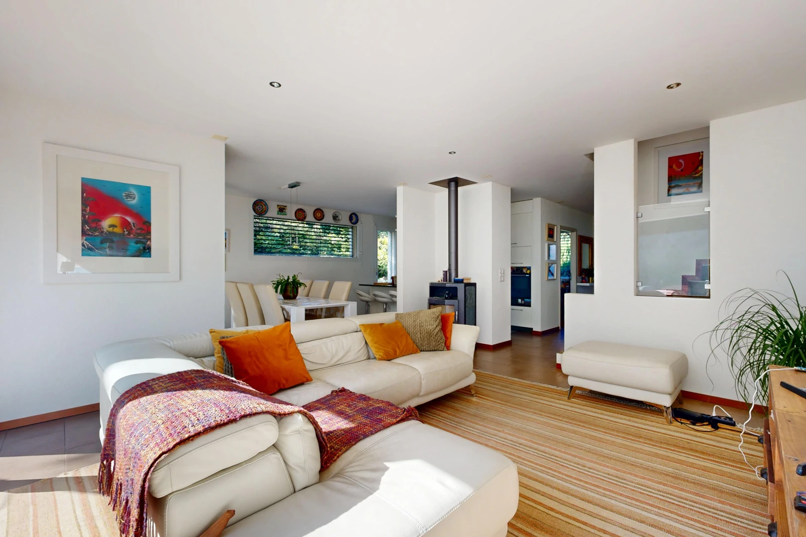 living room featuring a wood stove and recessed lighting