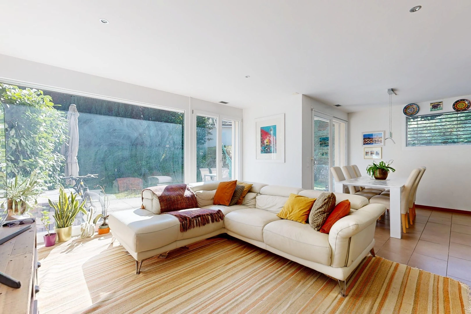 living / dining room featuring access to outside, recessed lighting, light tile patterned floors, and healthy amount of natural light