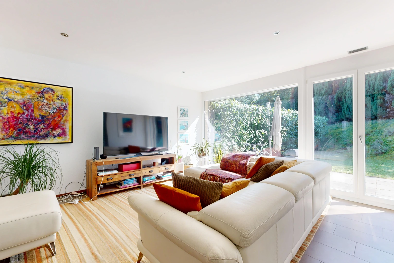 living area featuring access to exterior and recessed lighting