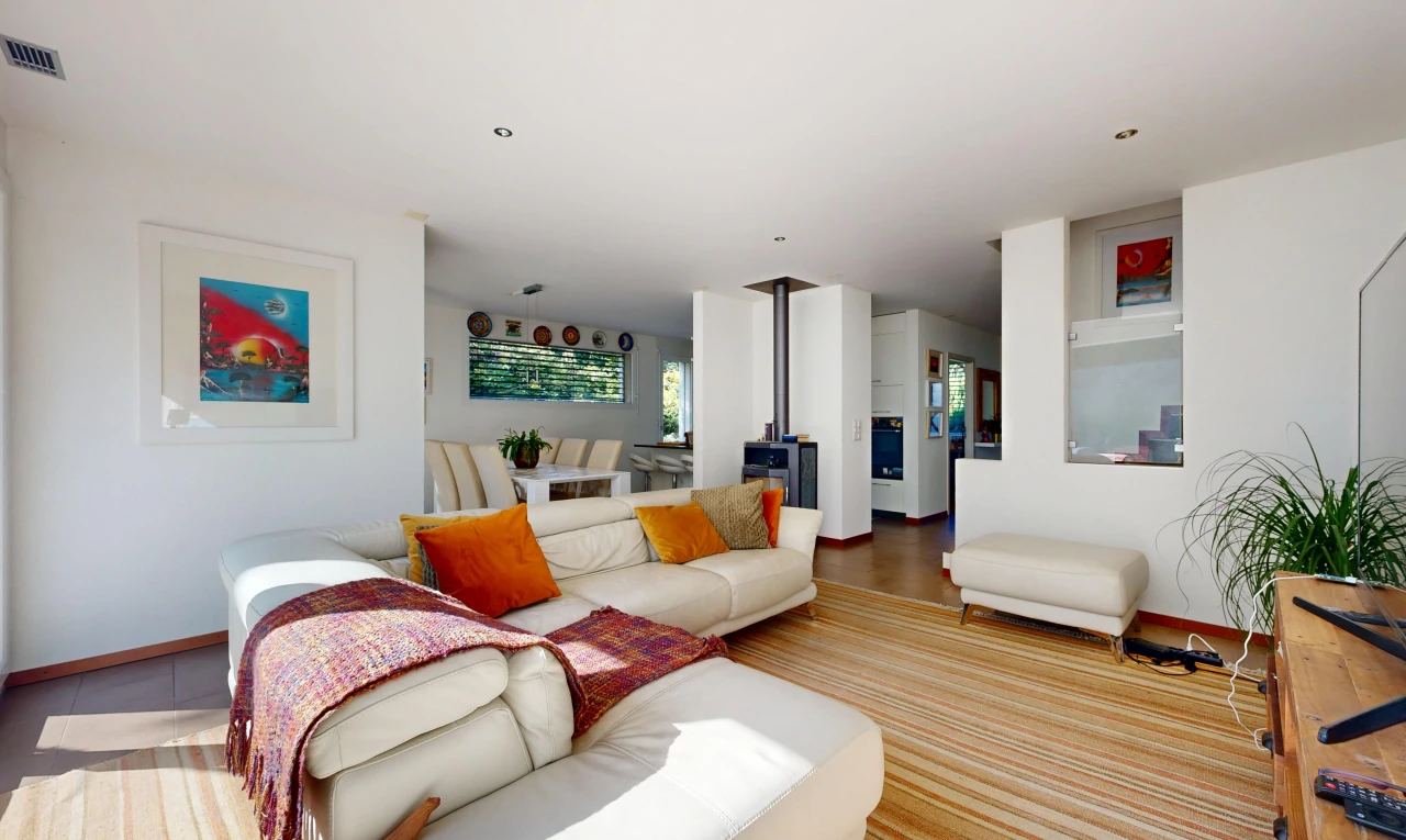 living room featuring a wood stove and recessed lighting