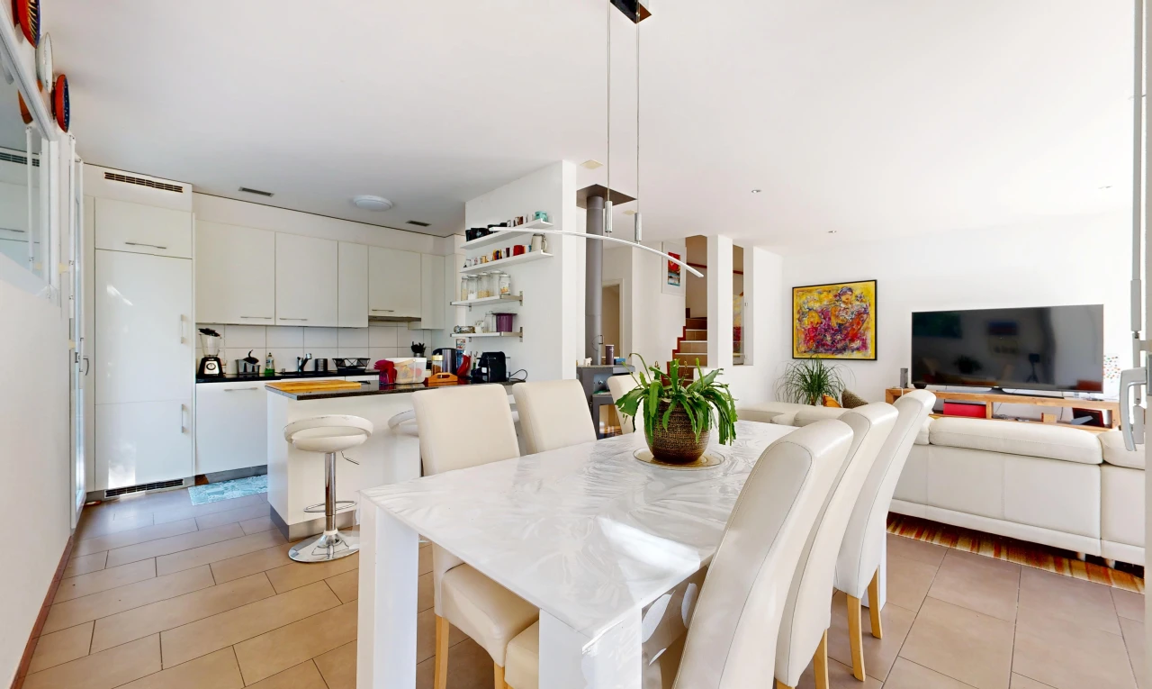 living / dining room with stairway and light tile patterned flooring