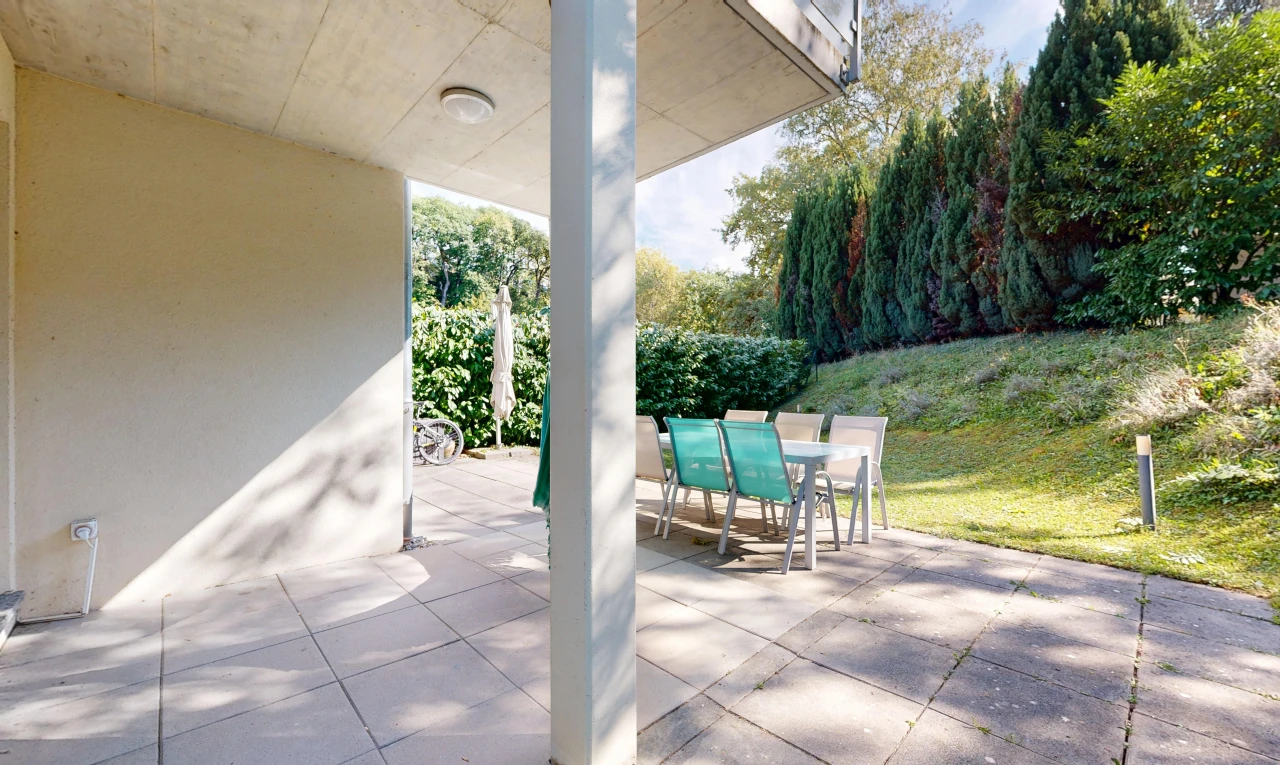 terrace featuring outdoor dining space and a patio area