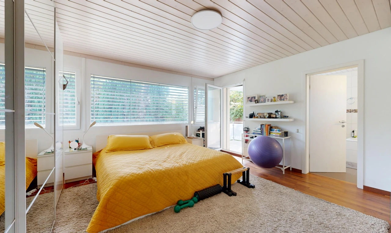 room with wood ceiling, wood finished floors, and access to exterior