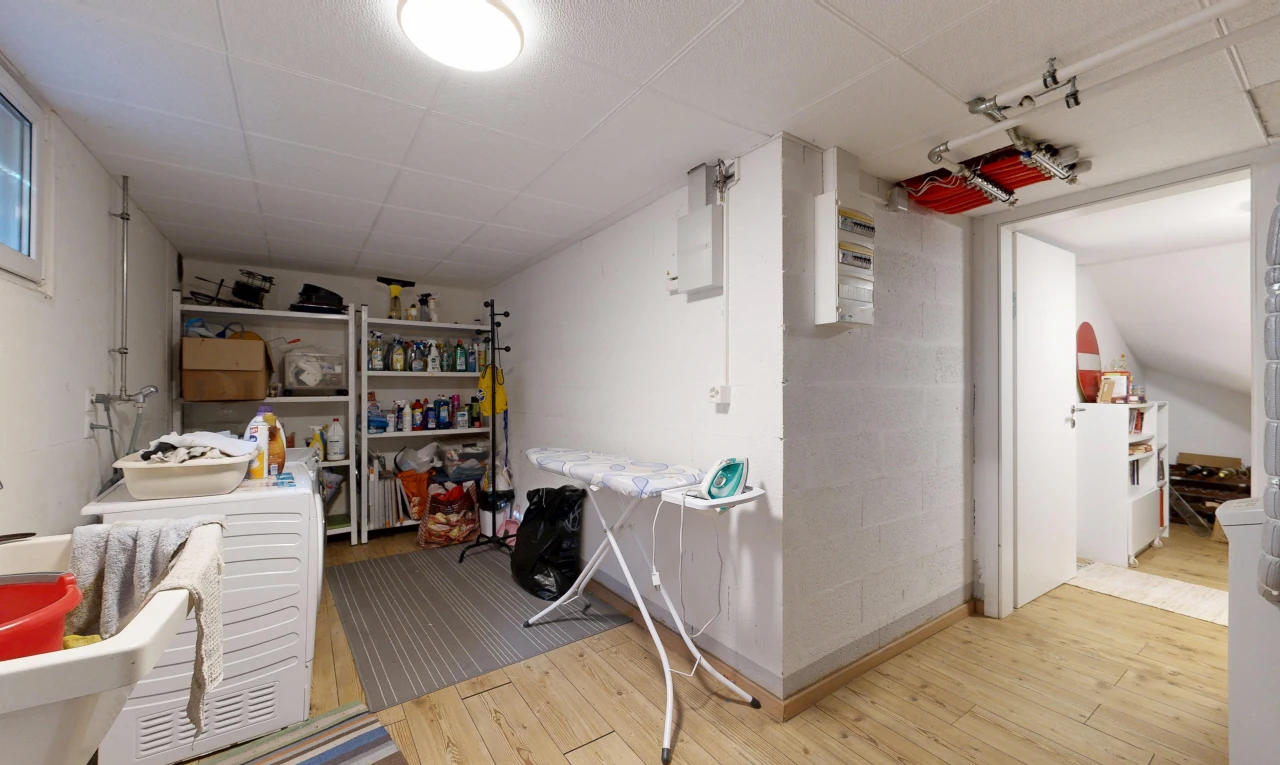 laundry room featuring light wood-style floors