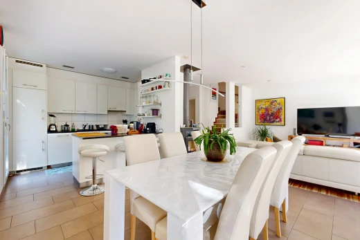 living / dining room with stairway and light tile patterned flooring
