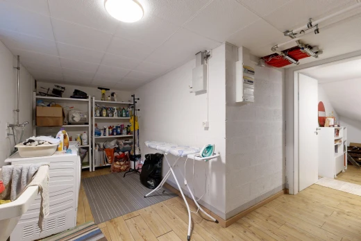 laundry room featuring light wood-style floors