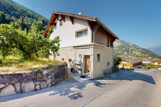 outdoor house with a mountain view and stucco siding