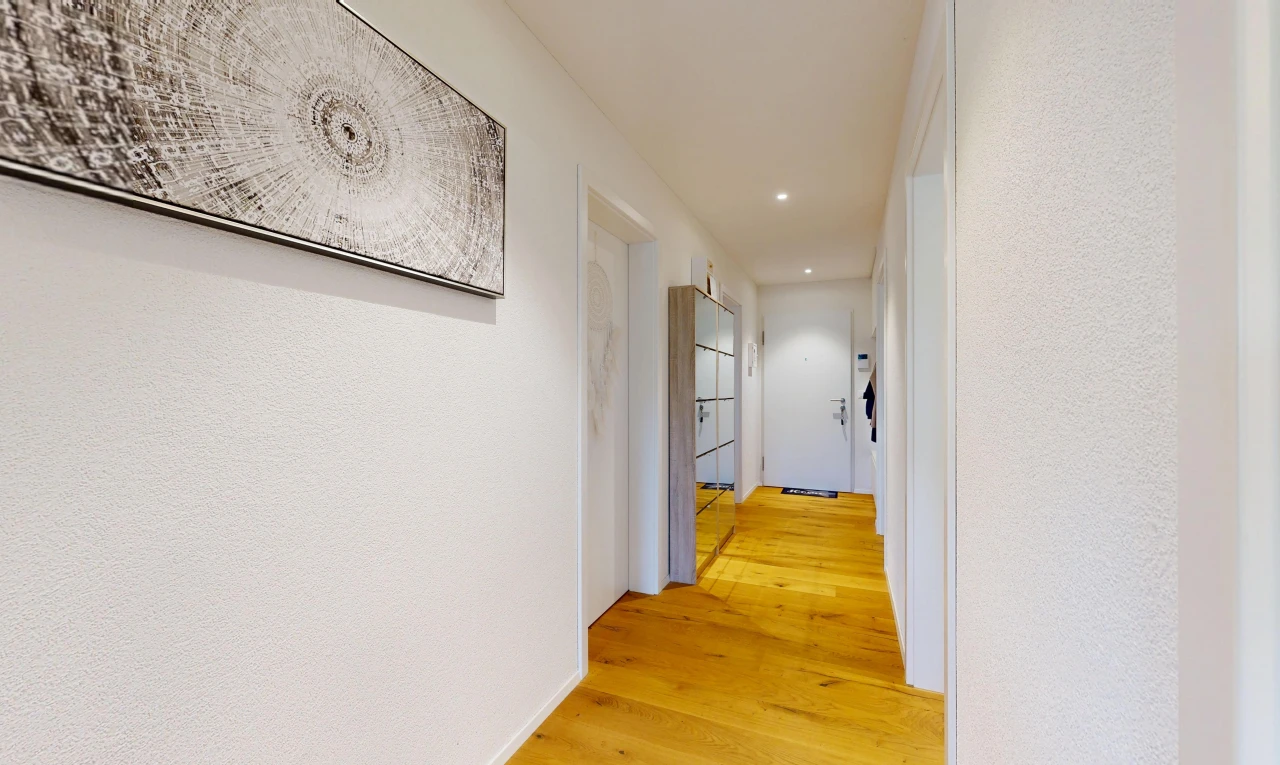 couloir avec light floor, éclairage encastré, wood finish floor, sol en finition bois, et inside property