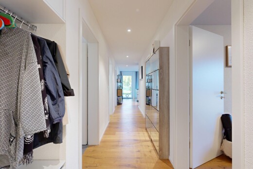 corridor with recessed lighting, light wood-style flooring, and access to outside