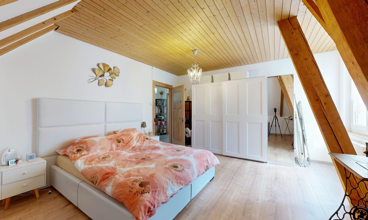 chambre avec cloison sèche, drywall, sol en finition bois, wood finish floor, et inside property