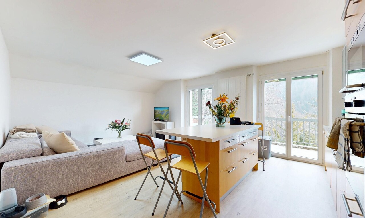 living / dining area with light wood-type flooring and lofted ceiling
