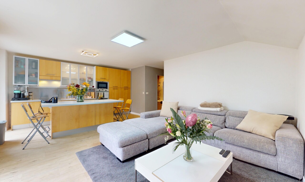 living area with light wood-type flooring and lofted ceiling