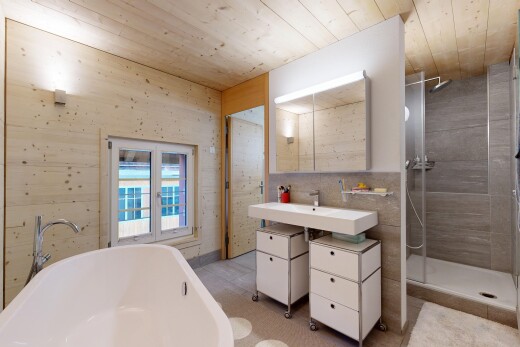 bathroom featuring wooden ceiling, a stall shower, and a freestanding bath