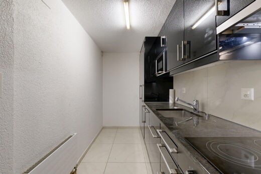 küche mit dark countertops, herd, light floor, stone countertops, und stein arbeitsplatten