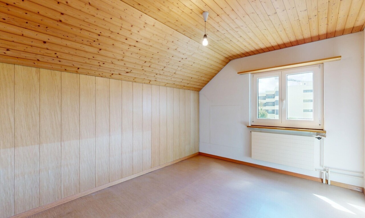 empty room with radiator heating unit, lofted ceiling, and wooden ceiling