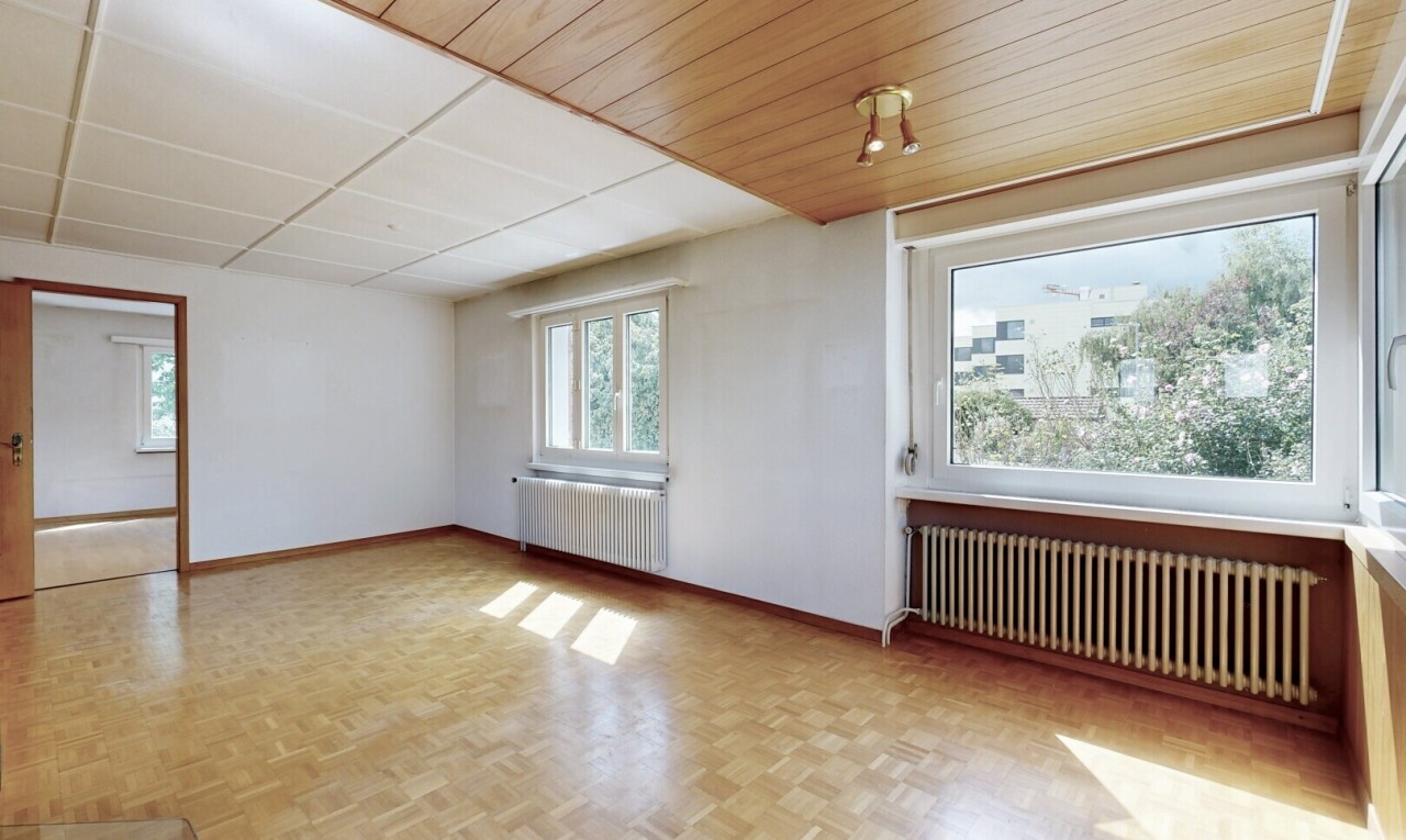spare room featuring radiator, radiator heating unit, and wooden ceiling