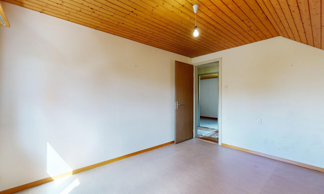 unfurnished room with baseboards and wood ceiling
