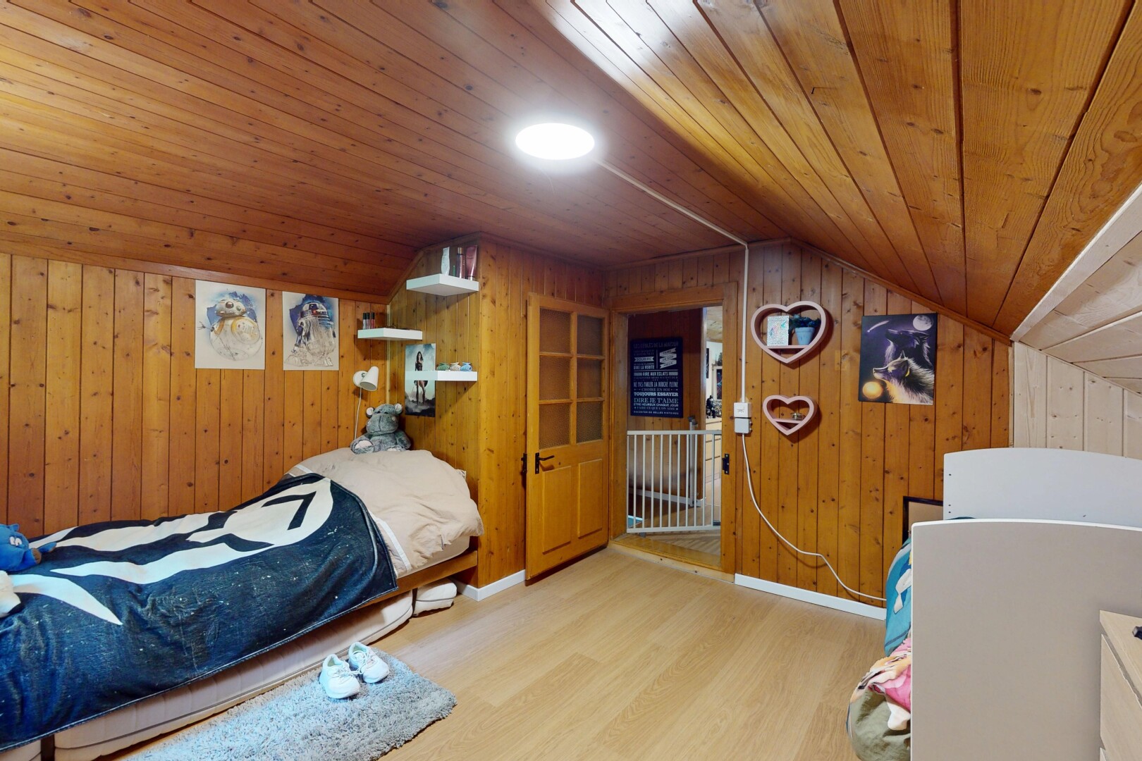 room with wood ceiling, wood walls, wood finished floors, and lofted ceiling