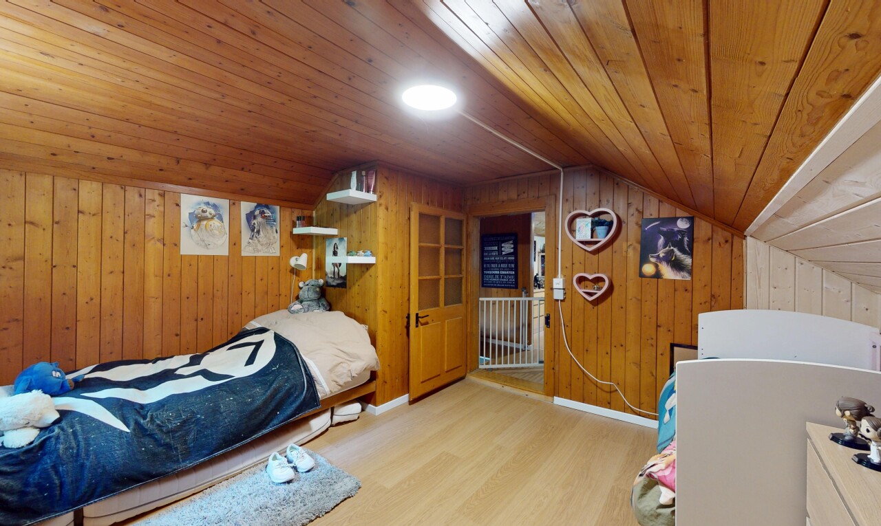 room with wood ceiling, wood walls, wood finished floors, and lofted ceiling