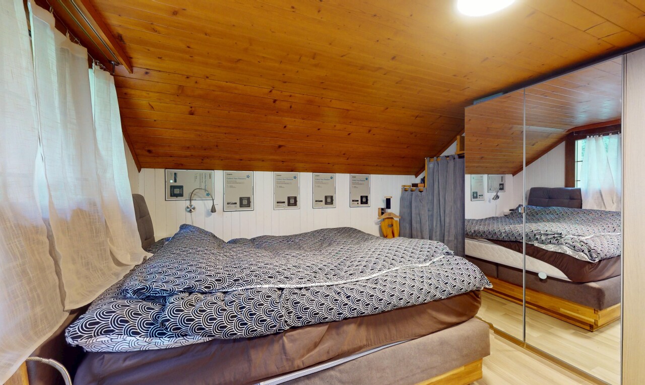 room with lofted ceiling, wood finished floors, and wooden ceiling