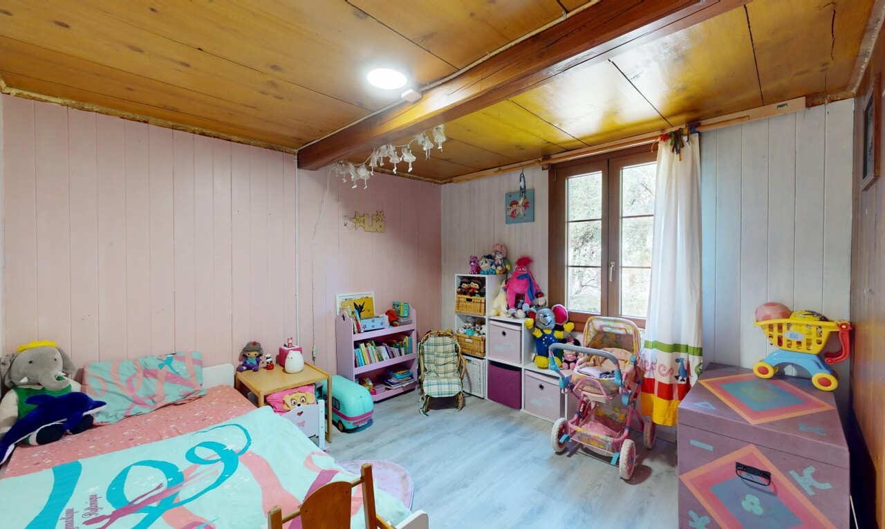 room with wood finished floors, wood ceiling, and wood walls