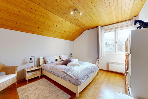 room featuring radiator heating unit, parquet flooring, and a vaulted wooden ceiling