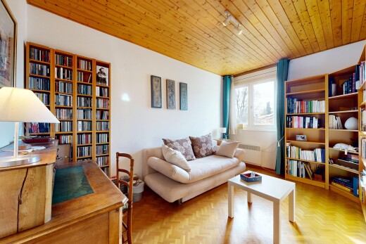 living area featuring parquet flooring, wooden ceiling, and radiator