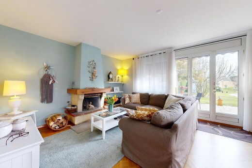 living room featuring parquet flooring and a fireplace