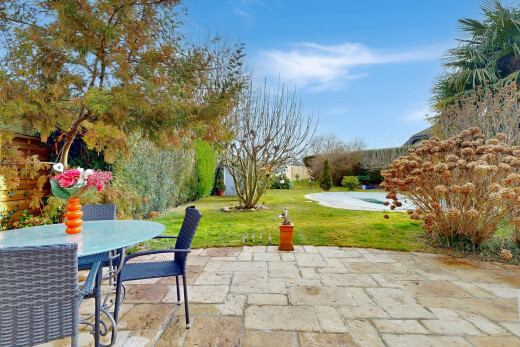 garden featuring a lawn, outdoor dining space, and a patio area