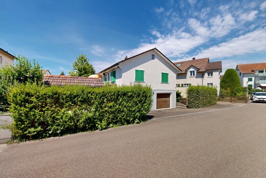 außenansicht mit eingebaute garage, day time, und auffahrt