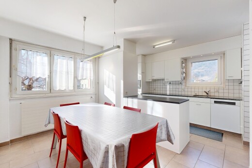 kitchen with backsplash, white cabinetry, white dishwasher, dark countertops, and light tile patterned floors
