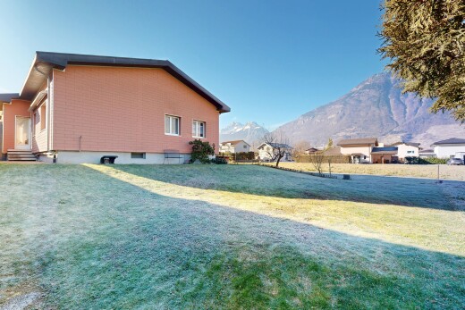 outdoor house with a yard and a mountain view