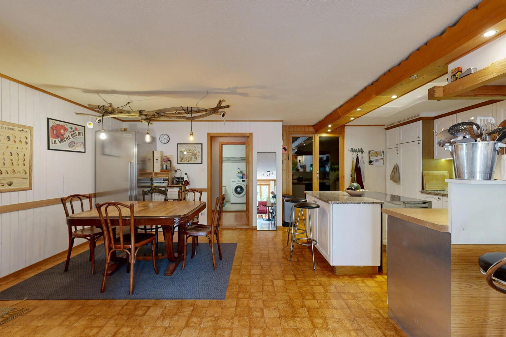 dining space featuring hanging light fixtures and light floors