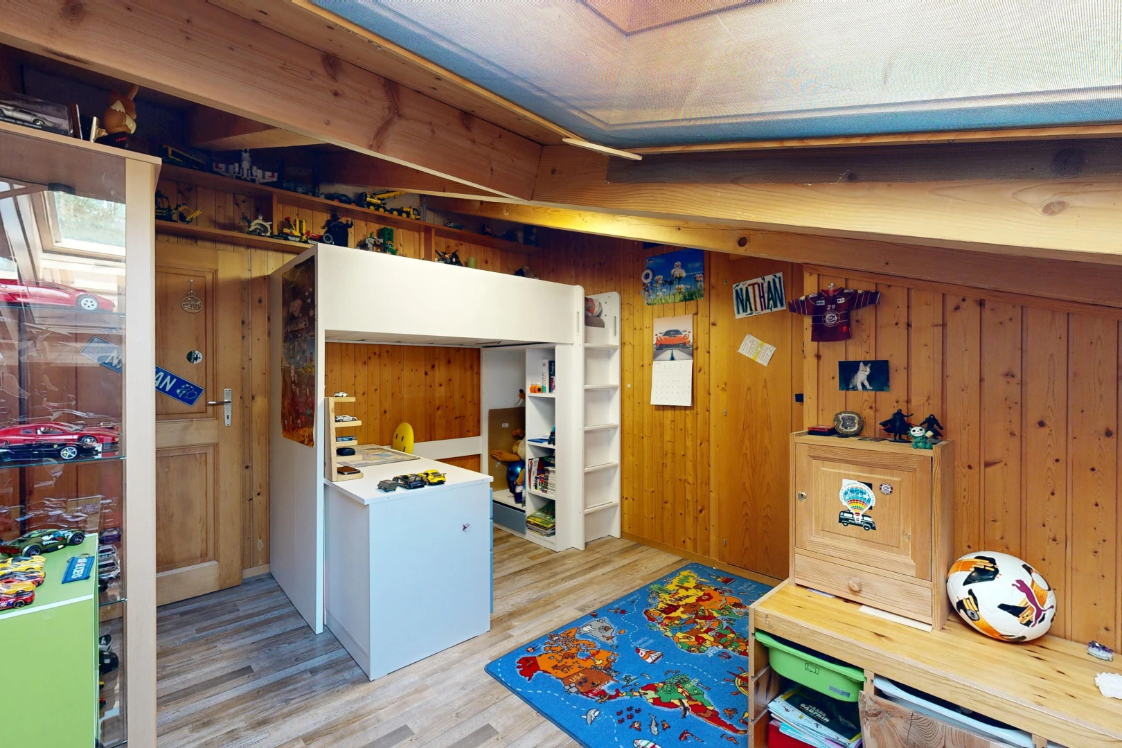 kitchen featuring light wood-type flooring and wood walls